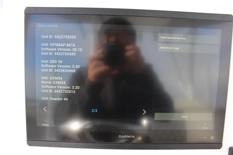 Slide: The Image of Garmin display on 2023 Front Runner 33 Center Console showing software versions and unit IDs. - 32