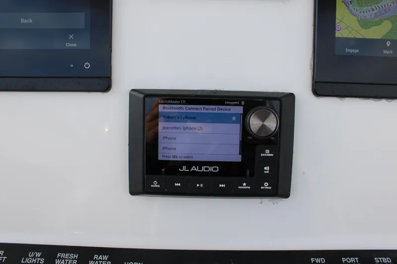 Slide: The Image of JL Audio system on 2023 Front Runner 33 Center Console boat dashboard. - 35