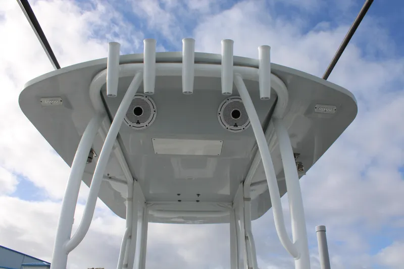 Slide: The Image of 2023 Front Runner 33 Center Console boat top view with rod holders and speakers. - 36