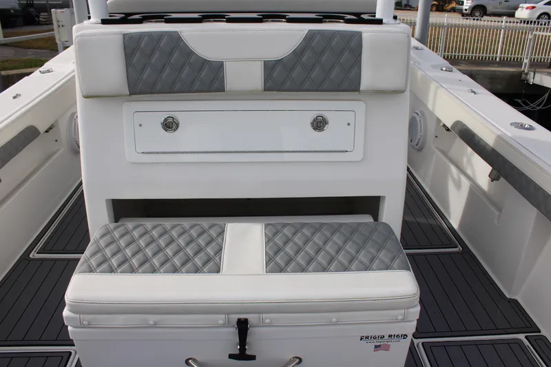 Slide: The Image of 2023 Front Runner 33 Center Console boat interior with quilted seating and storage. - 37