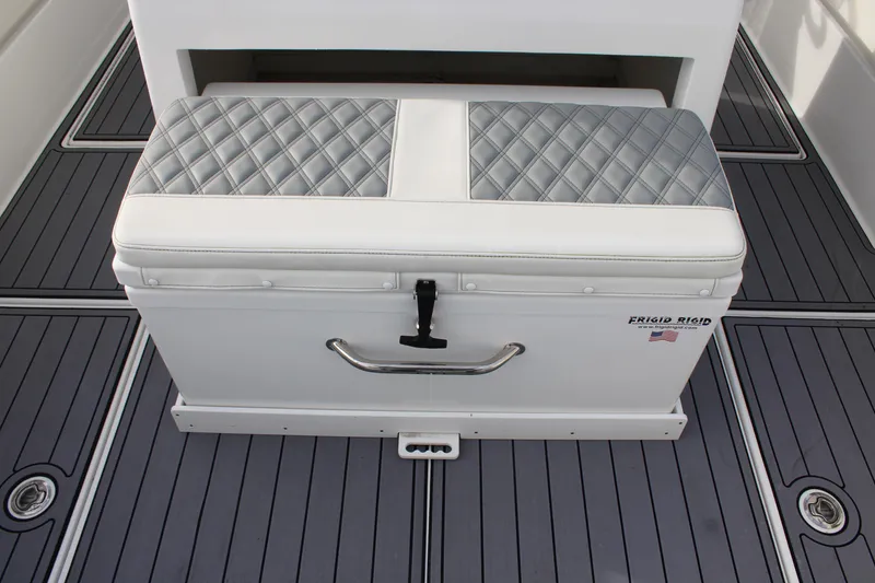 Slide: The Image of 2023 Front Runner 33 Center Console boat seat with quilted cushion and storage. - 38