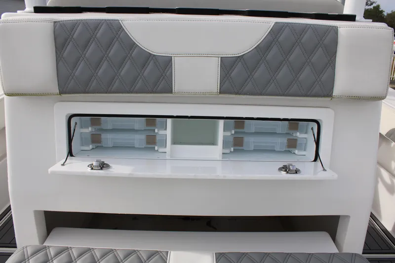 Slide: The Image of 2023 Front Runner 33 Center Console boat with cushioned seating and storage compartment. - 39