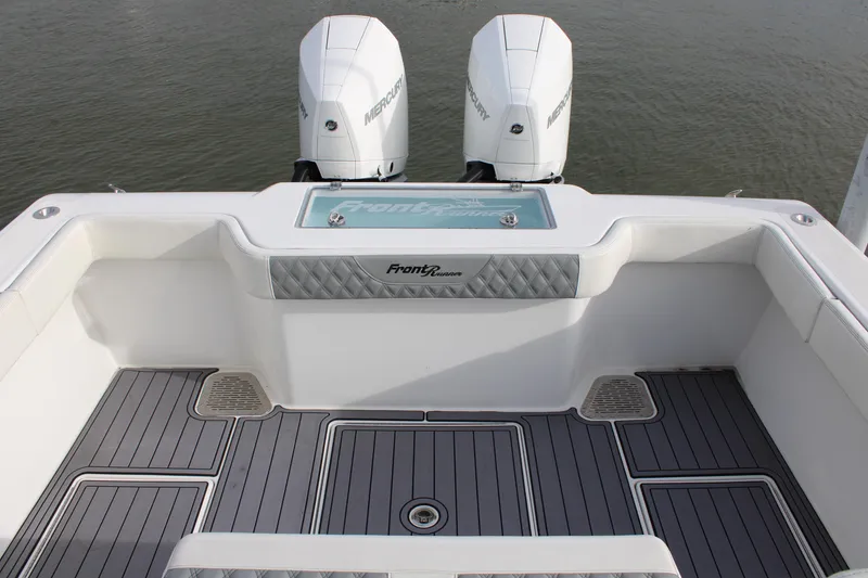Slide: The Image of 2023 Front Runner 33 Center Console boat with twin Mercury engines, featuring a sleek deck design. - 43