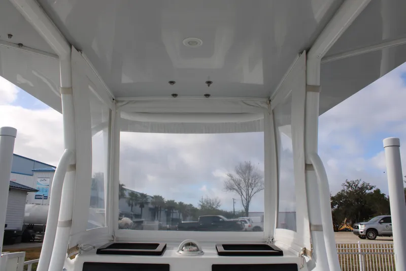 Slide: The Image of 2023 Front Runner 33 Center Console boat interior with clear enclosure and overhead view. - 45