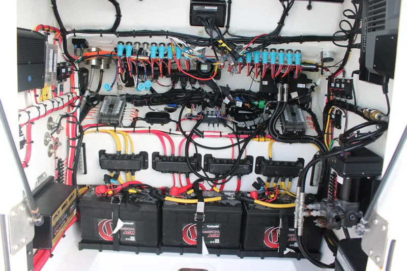 Slide: The Image of 2023 Front Runner 33 Center Console electrical system with batteries and wiring. - 46