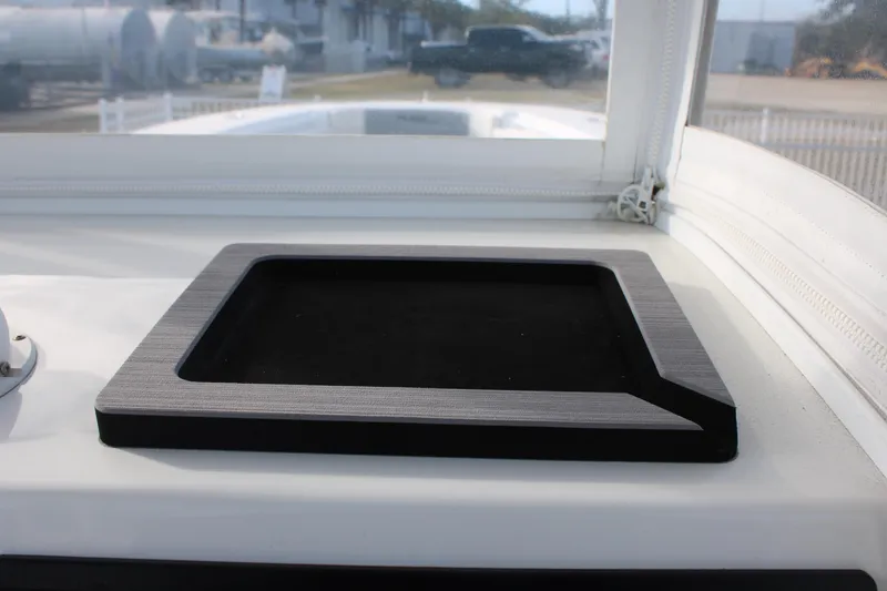 Slide: The Image of 2023 Front Runner 33 Center Console dashboard detail with sleek black panel. - 5