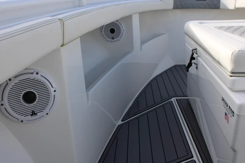 Slide: The Image of 2023 Front Runner 33 Center Console interior with speakers and cushioned seating. - 8
