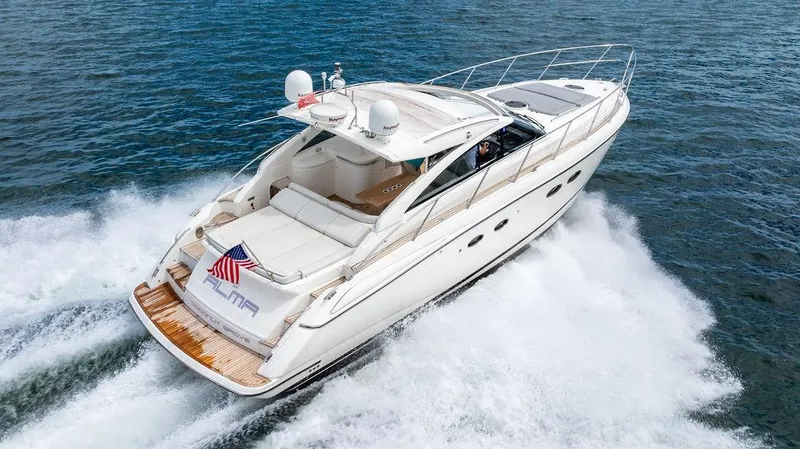 Slide: The Image of 2012 Princess V45 yacht cruising on open water, rear view. - 10