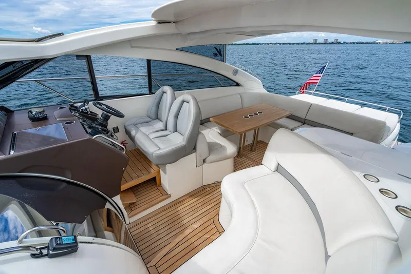 Slide: The Image of Luxurious 2012 Princess V45 yacht interior with leather seating and wooden flooring. - 13