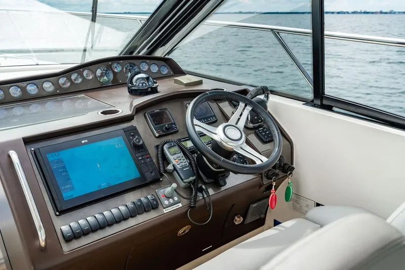 Slide: The Image of Interior helm of 2012 Princess V45 yacht with navigation equipment and steering wheel. - 19