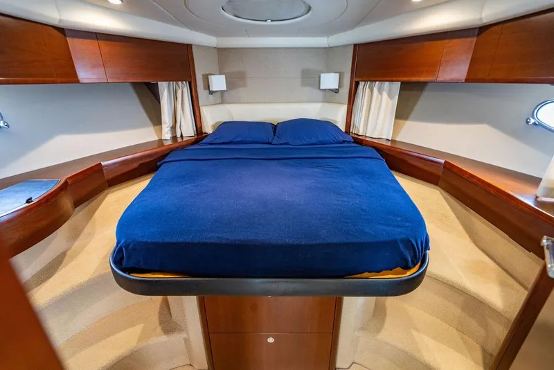 Slide: The Image of Luxurious cabin interior of 2012 Princess V45 yacht with blue bedding. - 29
