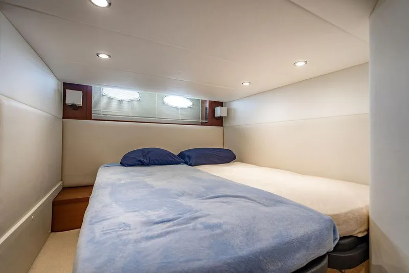 Slide: The Image of Luxurious cabin interior of 2012 Princess V45 yacht with cozy bedding. - 31