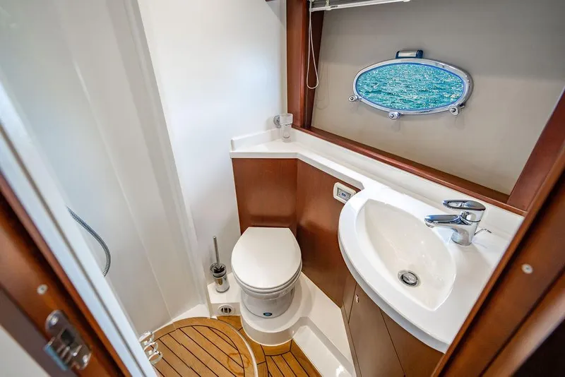 Slide: The Image of Luxurious bathroom in 2012 Princess V45 yacht with ocean view porthole. - 33