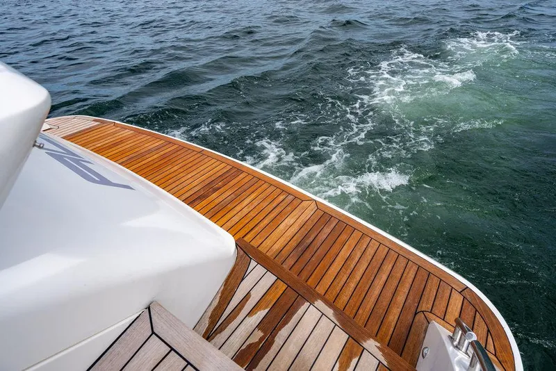 Slide: The Image of Sleek 2012 Princess V45 yacht with teak deck on open water. - 39
