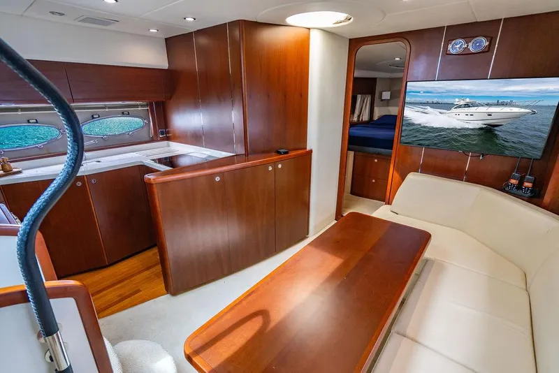 Slide: The Image of Luxurious 2012 Princess V45 yacht interior with wood finishes and modern amenities. - 4