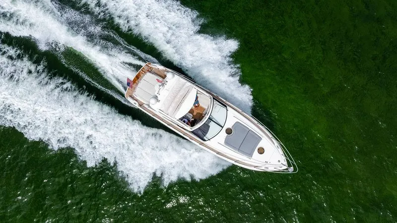 Slide: The Image of Aerial view of 2012 Princess V45 yacht cruising on green water. - 8
