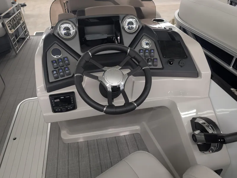 Slide: The Image of 2025 Sylvan L3 DLZ Bar boat dashboard with steering wheel and control panel. - 15