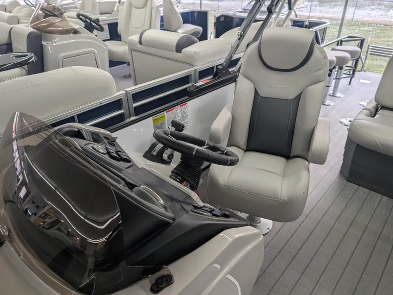 Slide: The Image of 2025 Sylvan L3 DLZ Bar boat interior with plush seating and modern helm. - 6