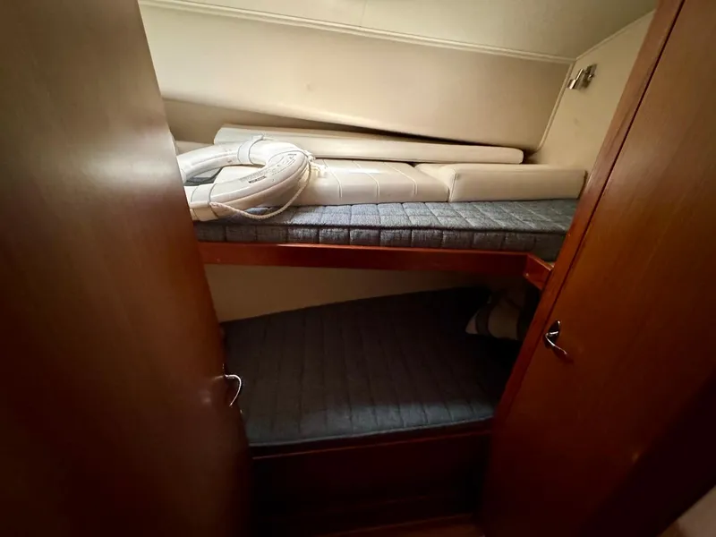 Slide: The Image of Interior cabin of 2011 Henriques 42 Sportfisherman with bunk beds and wooden finish. - 10