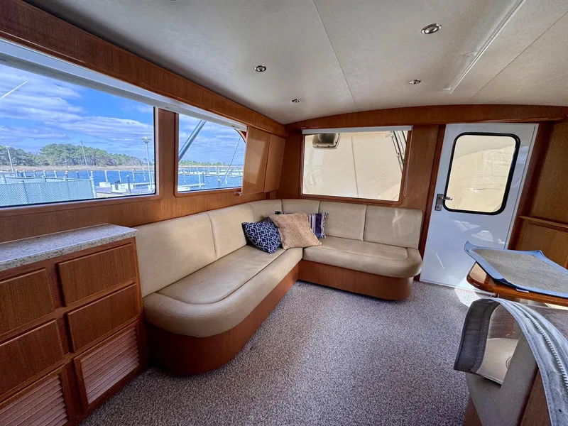Slide: The Image of Interior of 2011 Henriques 42 Sportfisherman with beige seating and wood accents. - 7