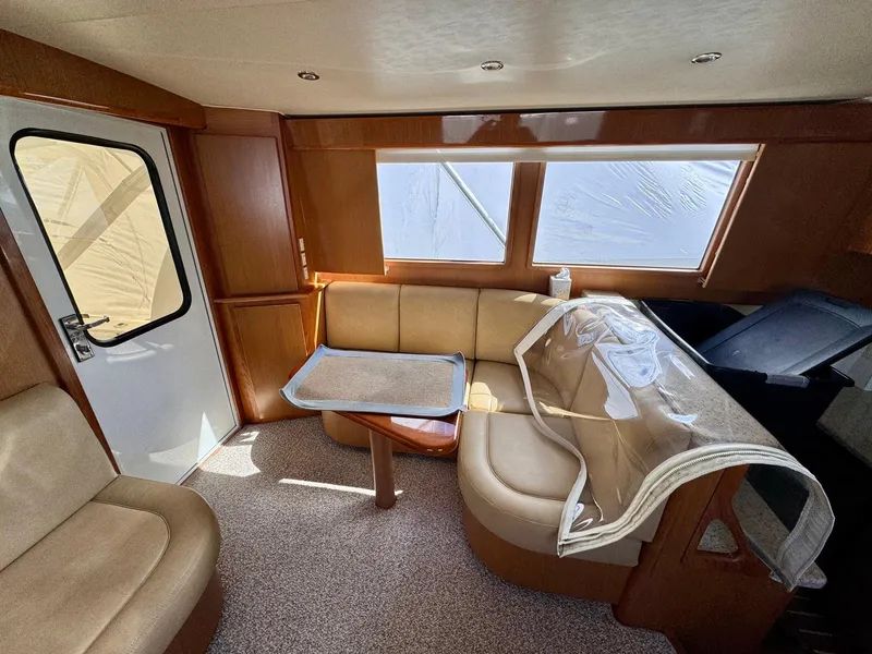Slide: The Image of Interior of 2011 Henriques 42 Sportfisherman with beige seating and wooden accents. - 8