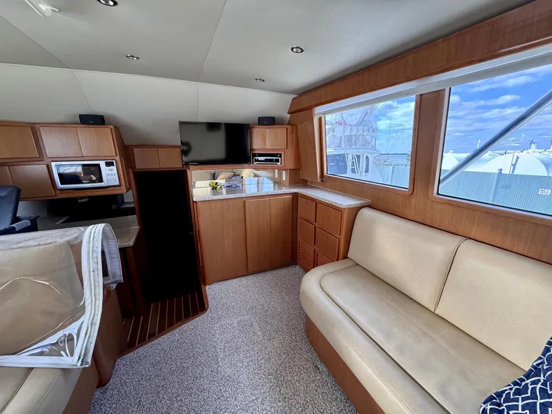 Slide: The Image of Interior of 2011 Henriques 42 Sportfisherman yacht with modern kitchen and seating area. - 9