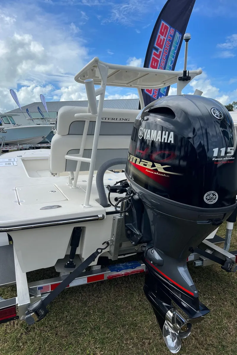 Slide: The Image of 2023 Sterling 180TS boat with Yamaha 115 engine displayed outdoors. - 10