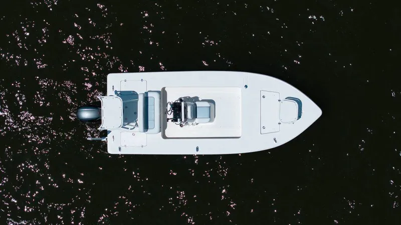 Slide: The Image of Aerial view of 2023 Sterling 180TS boat on dark water. - 11