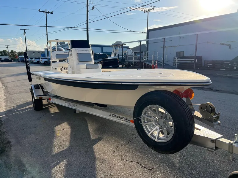 Slide: The Image of 2023 Sterling 180TS boat on trailer in sunny outdoor setting. - 4