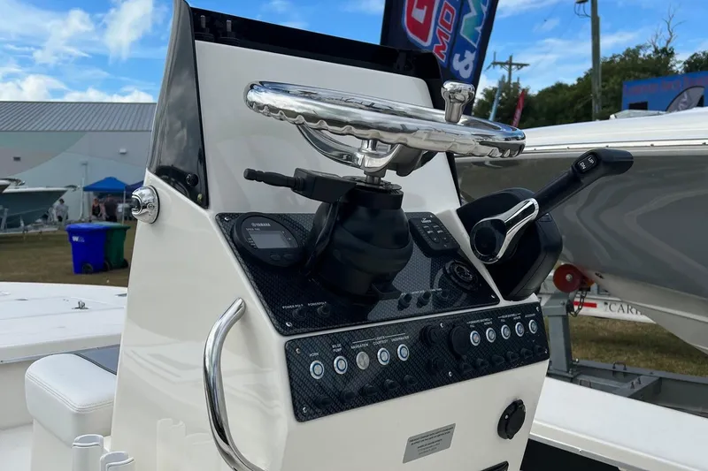 Slide: The Image of 2023 Sterling 180TS boat console with steering wheel and controls. - 6