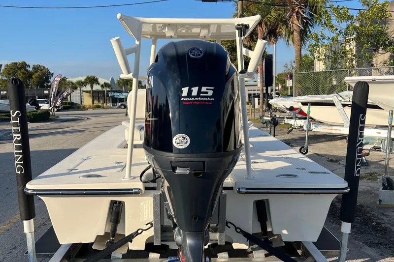 Slide: The Image of 2023 Sterling 180TS boat with 115 horsepower engine, parked outdoors. - 8