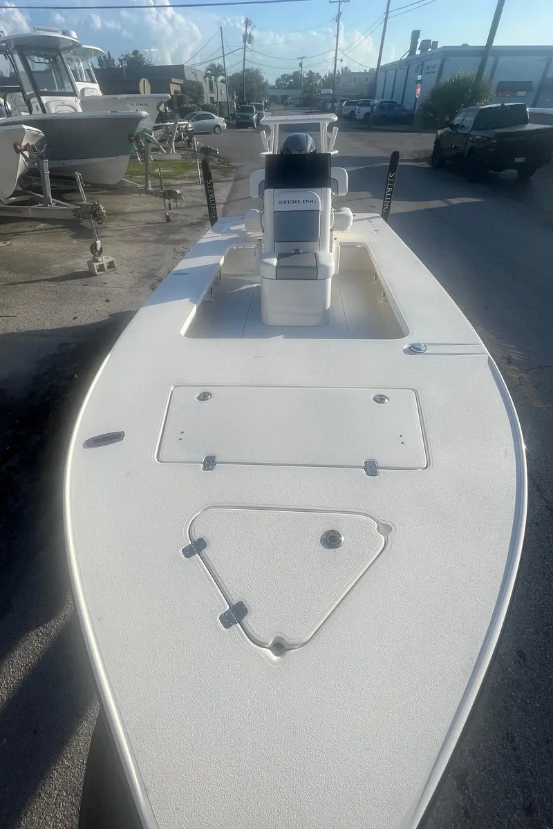 Slide: The Image of 2023 Sterling 180TS boat, white deck, outdoor setting, clear sky. - 9