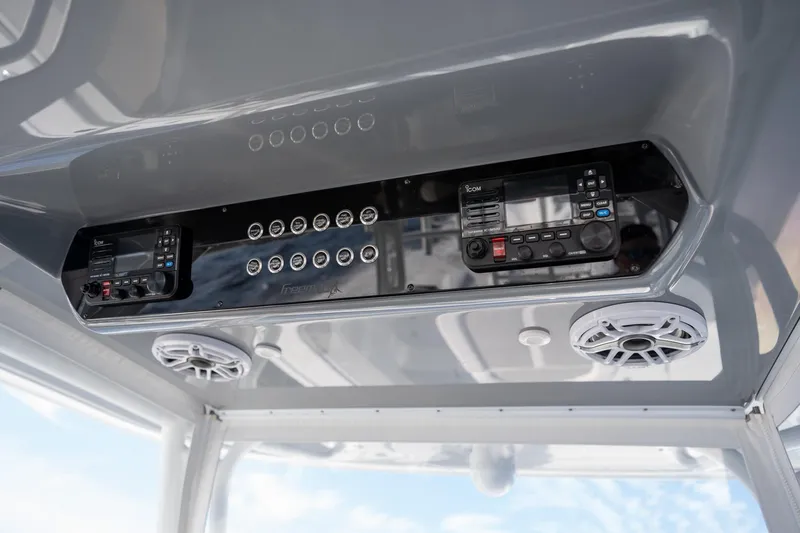 Slide: The Image of 2023 Freeman 42 LR boat console with controls and speakers. - 16