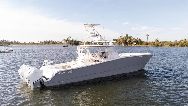 Slide: The Image of 2023 Freeman 42 LR boat on calm water, side view. - 31