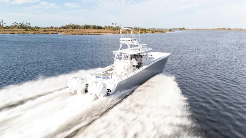 Slide: The Image of 2023 Freeman 42 LR boat cruising swiftly on open water. - 34