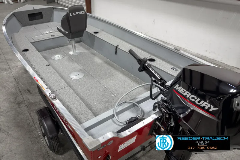 Slide: The Image of 2025 Lund 1600 Fury Heritage Edition boat with Mercury outboard motor in showroom. - 10