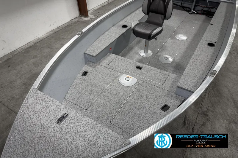 Slide: The Image of 2025 Lund 1600 Fury Heritage Edition boat interior with seating and storage compartments. - 11