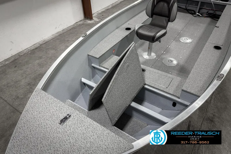 Slide: The Image of 2025 Lund 1600 Fury Heritage Edition boat interior with seating and storage compartments. - 12