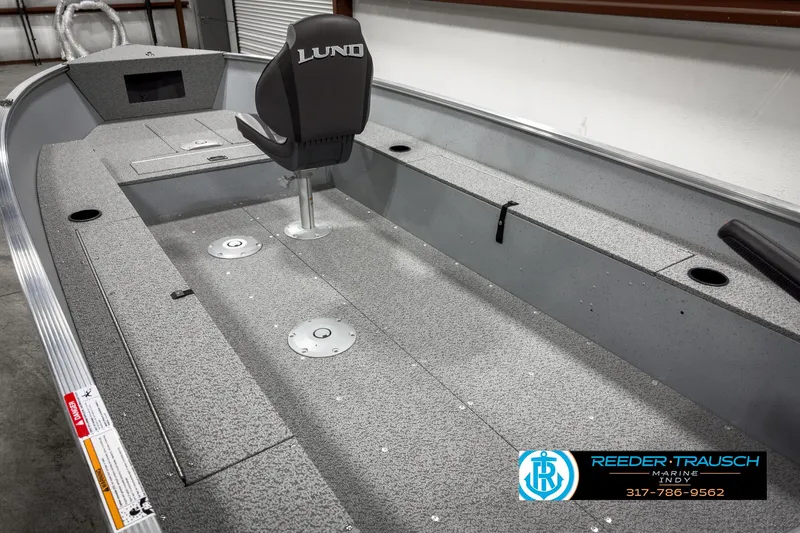 Slide: The Image of 2025 Lund 1600 Fury Heritage Edition boat interior with seating and storage. - 13