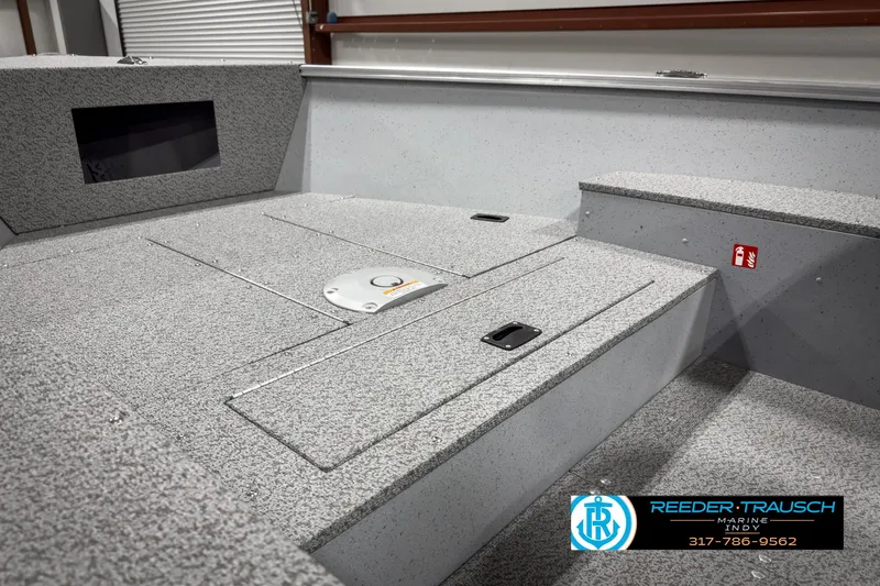 Slide: The Image of 2025 Lund 1600 Fury Heritage Edition boat interior with storage compartments. - 15