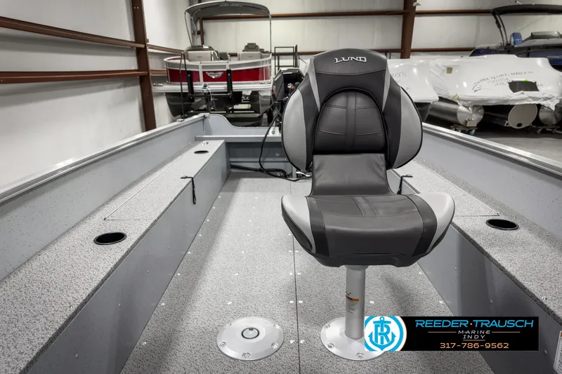 Slide: The Image of 2025 Lund 1600 Fury Heritage Edition boat interior with a comfortable swivel seat. - 18