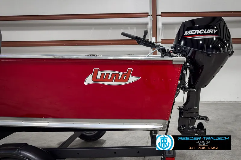 Slide: The Image of 2025 Lund 1600 Fury Heritage Edition boat with Mercury outboard motor, red exterior. - 20