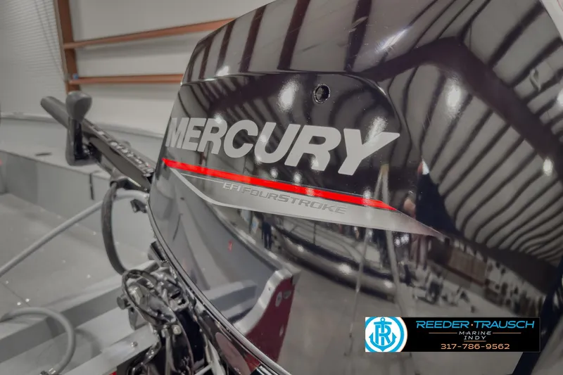 Slide: The Image of 2025 Lund 1600 Fury Heritage Edition with Mercury outboard motor in showroom. - 21