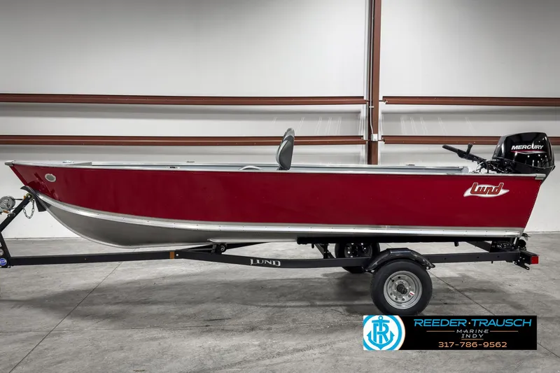 Slide: The Image of 2025 Lund 1600 Fury Heritage Edition boat in showroom, red exterior, on trailer. - 3