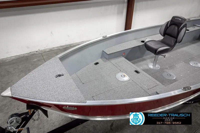 Slide: The Image of 2025 Lund 1600 Fury Heritage Edition boat with seating, displayed indoors. - 7