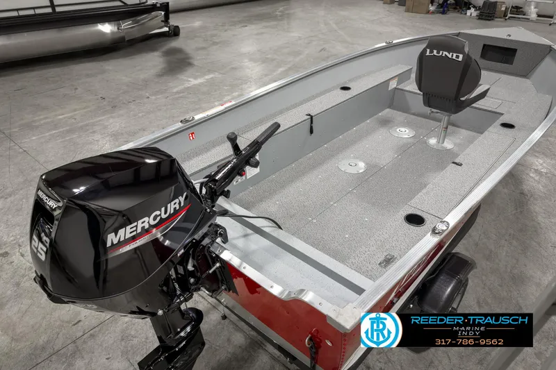 Slide: The Image of 2025 Lund 1600 Fury Heritage Edition boat with Mercury engine in showroom. - 9