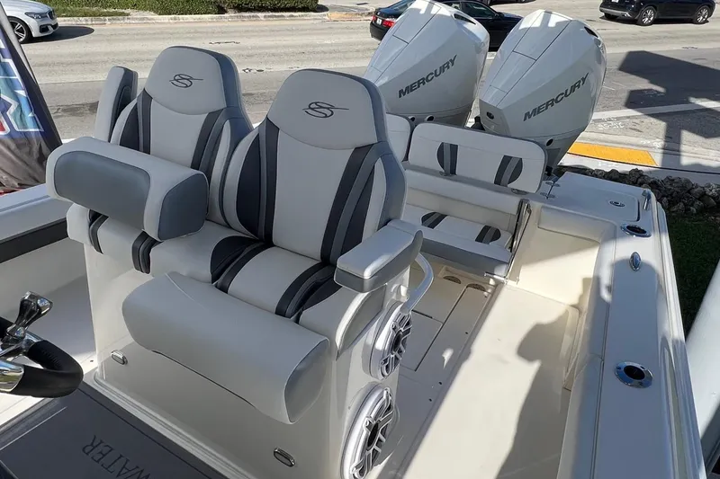 Slide: The Image of 2024 ShearWater 270 SS Open Carolina boat with dual Mercury engines and stylish seating. - 10