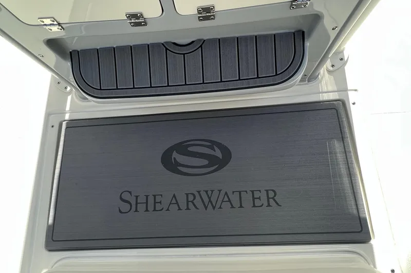 Slide: The Image of 2024 ShearWater 270 SS Open Carolina boat deck with logo. - 5