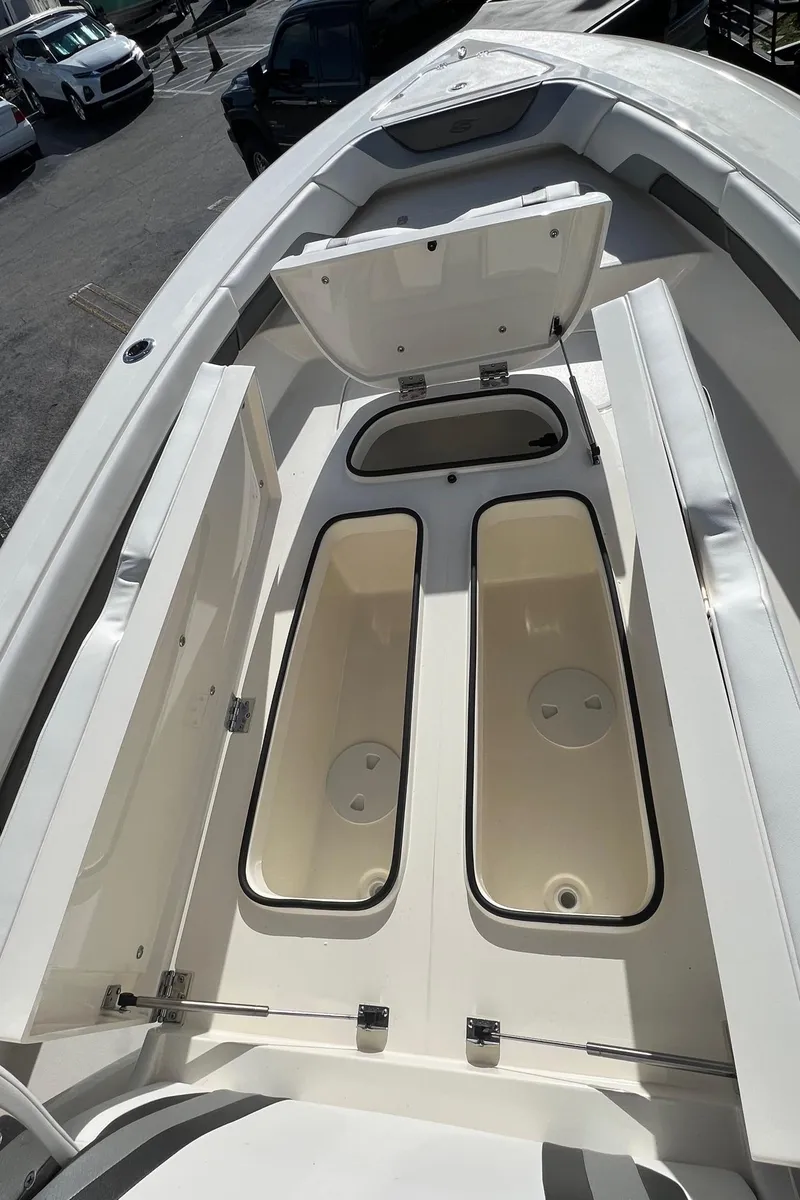 Slide: The Image of 2024 ShearWater 270 SS Open Carolina boat storage compartments open. - 8