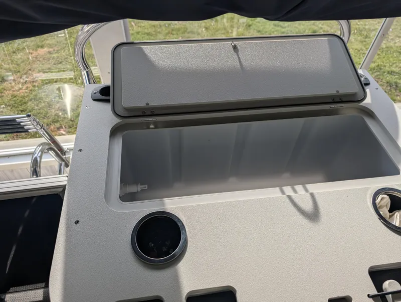 Slide: The Image of Open storage compartment on 2025 Sylvan Mirage Fish 8520 Party Fish boat. - 9